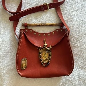 Mongolian leather bag with wooden handler